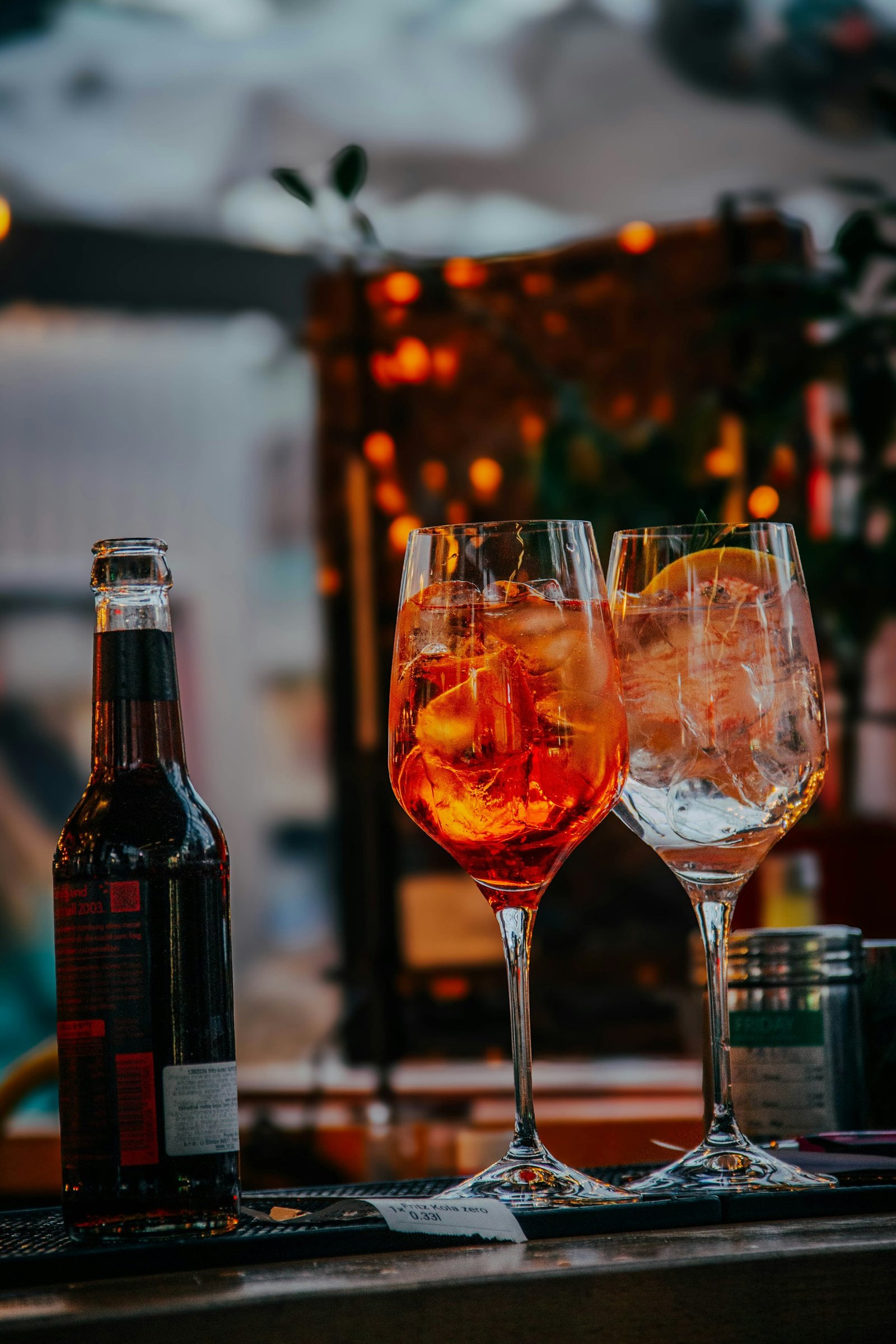 Two cocktails on a Prague bar counter with warm evening light