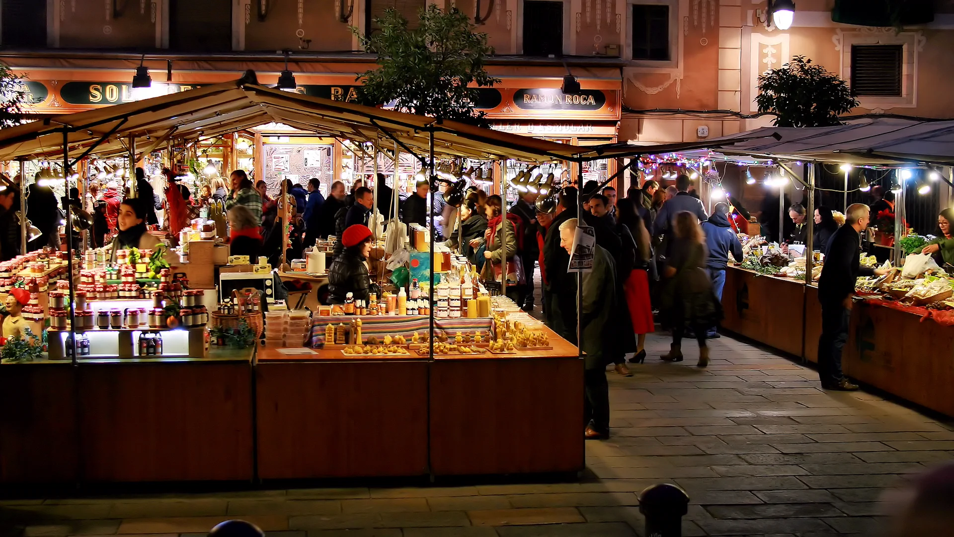 Food artisans market in Placa del Pi at night in Barcelona