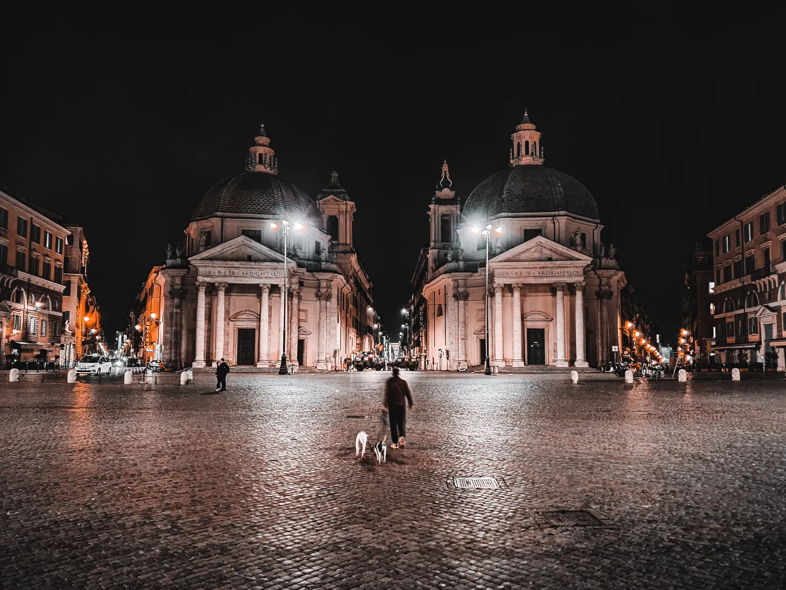 Piazza del Popolo and its twin churches lit at night in Rome